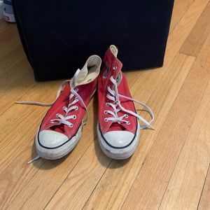 Heavily loved red hightop converse